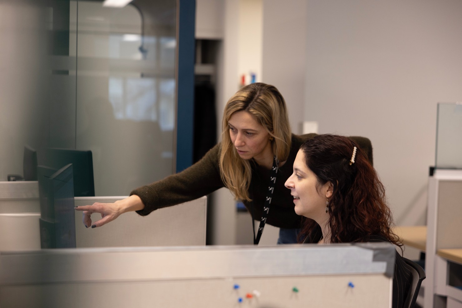 Bioinformatics specialists reviewing data analysis results