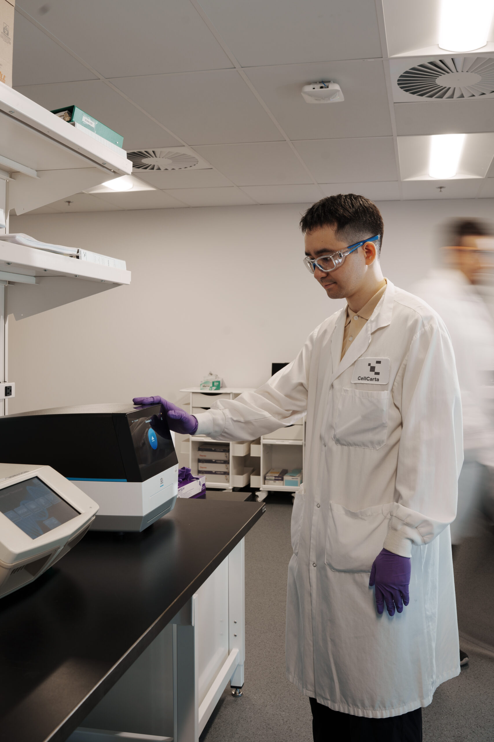 Scientist performing single cell sequencing at a laboratory bench.