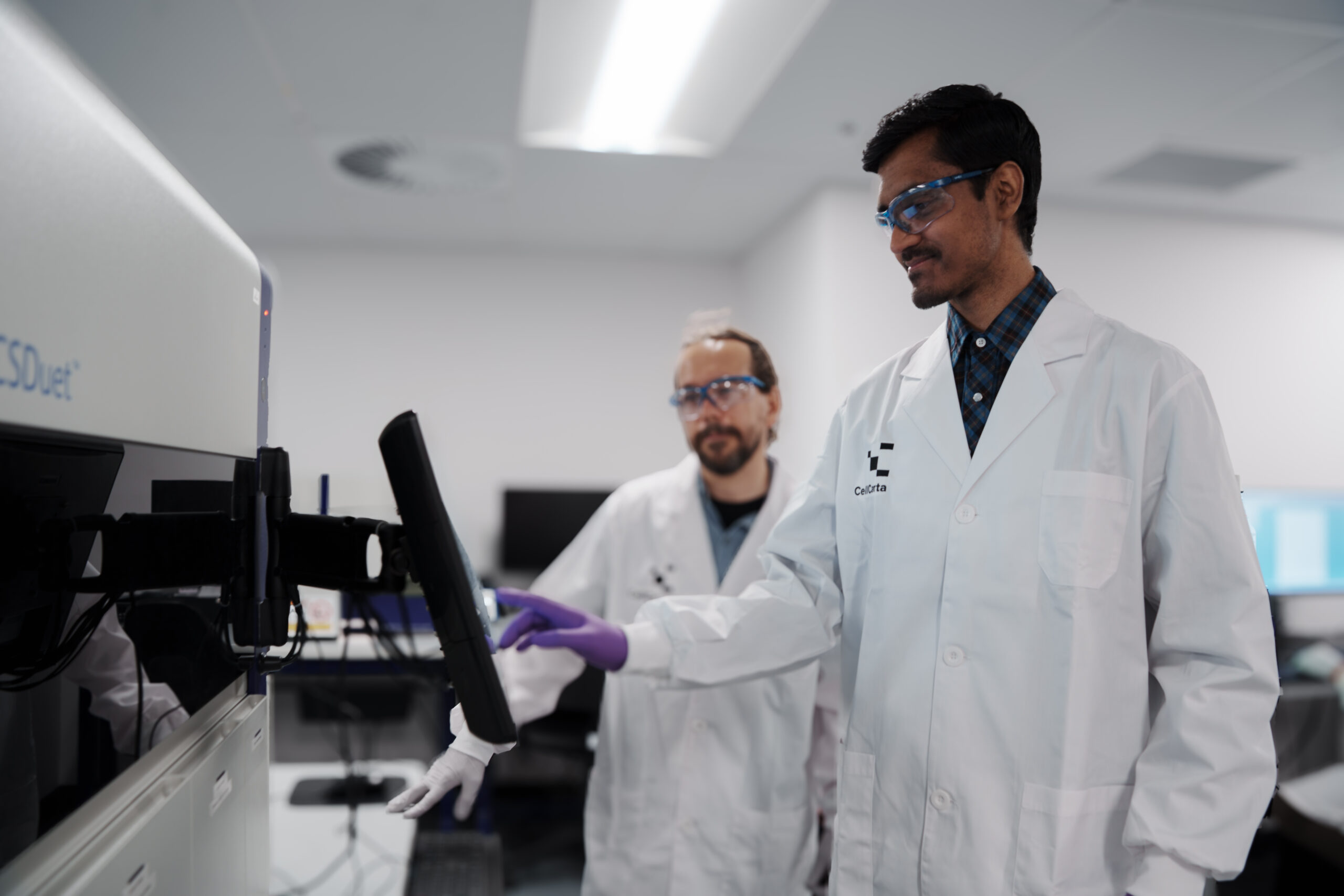 CellCarta scientist performing immune monitoring assays including flow cytometry and cell-based biomarker analysis